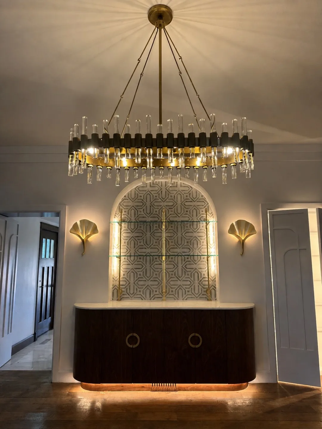 Elegant lighting feature over custom built-in cabinetry in a luxury home