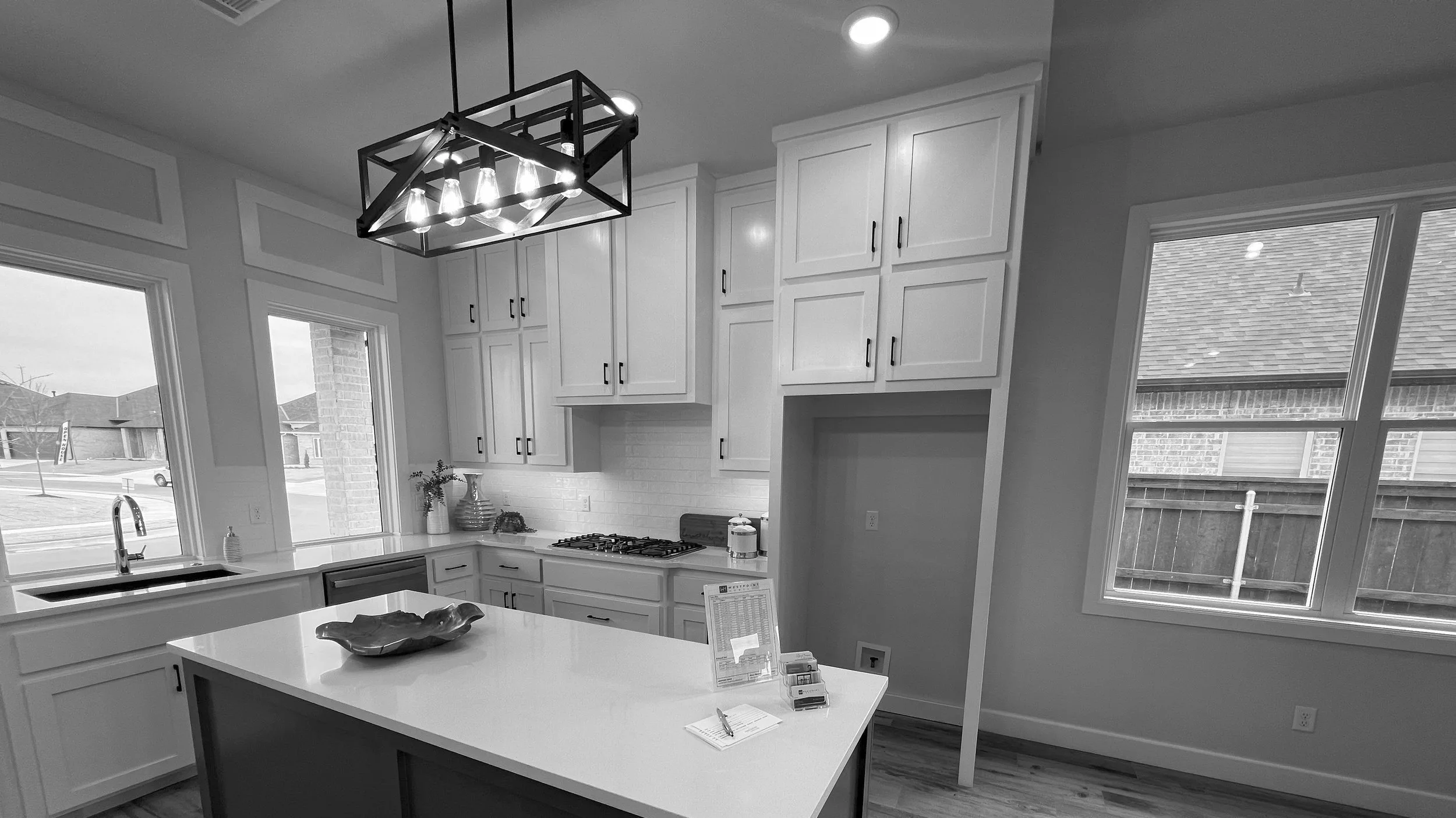 Finished kitchen with recessed lighting in a home