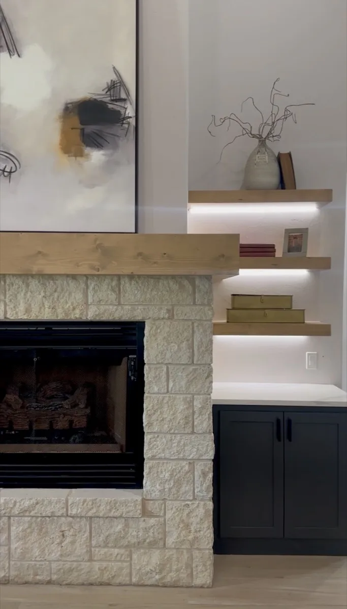 Fireplace with lighted floating shelves in an OKC home
