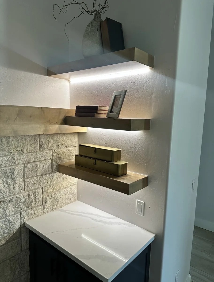 Floating shelves with integrated lighting in a home