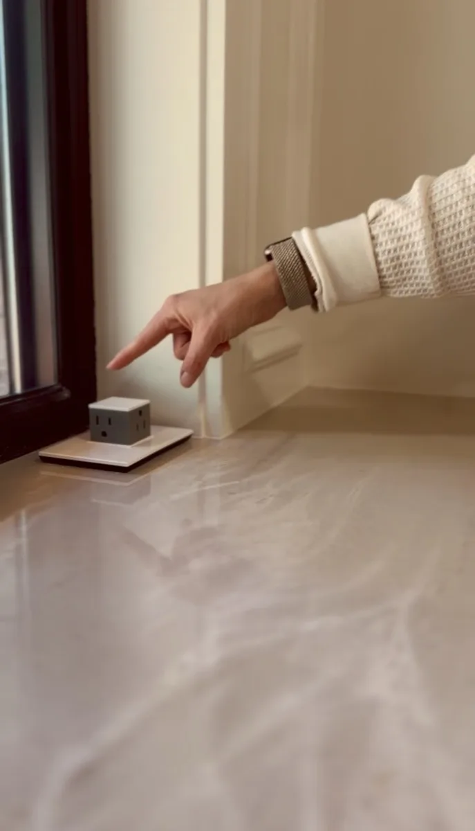 Floor outlet installation on marble flooring in a home