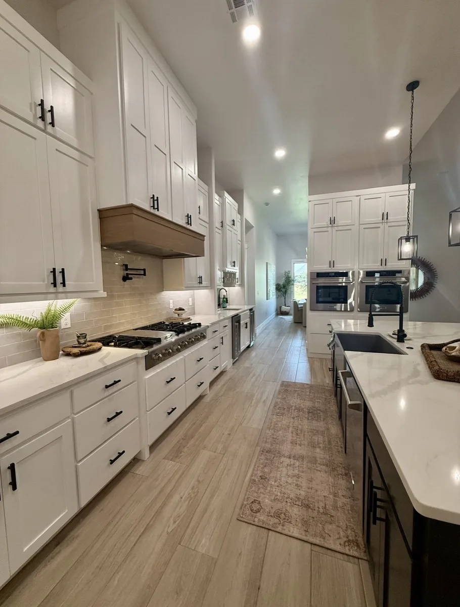 Arched cabinetry with gold accent light bars in a home