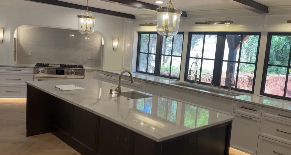 Built-in cabinetry with gold accent lighting in a home