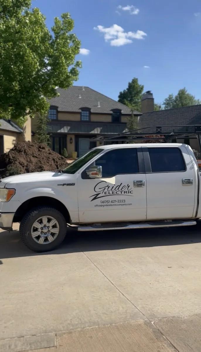 Grider Electric truck parked at a new construction home