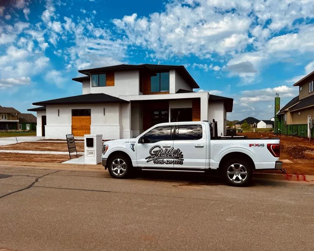 Grider Electric service truck parked in front of a newly built two-story home in Oklahoma City