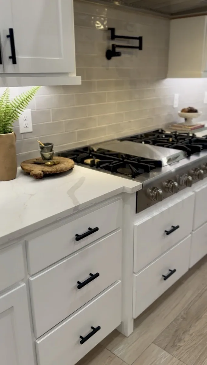 Kitchen backsplash with pot filler installation in a home