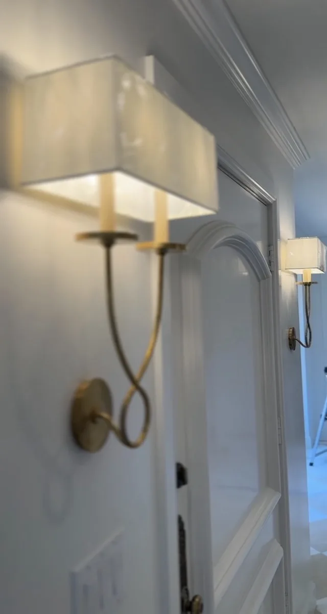 Kitchen pantry cabinetry with under-cabinet lighting in a home