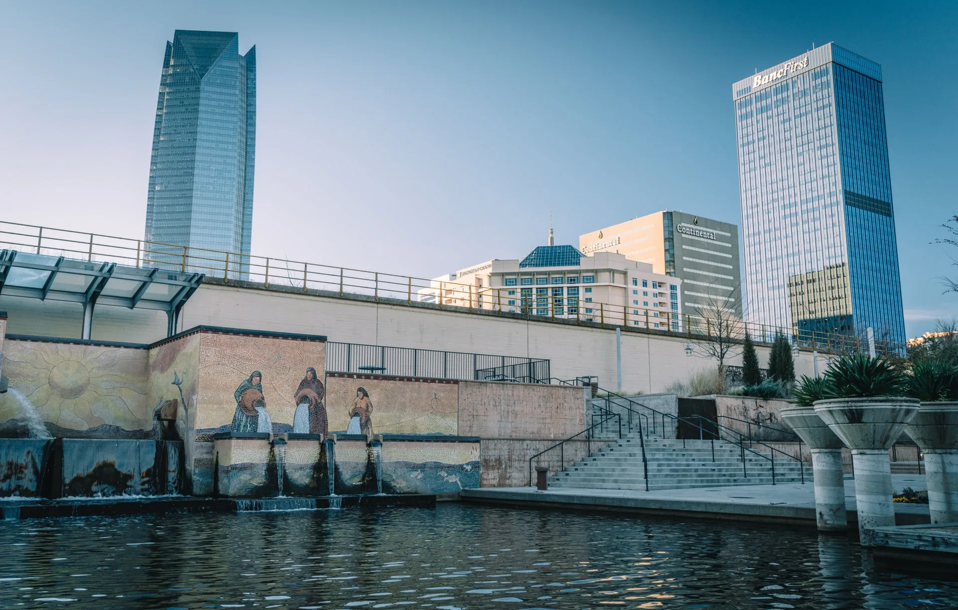 Oklahoma City skyline with the Bricktown canal and mural, including Devon Energy Center and BancFirst Tower