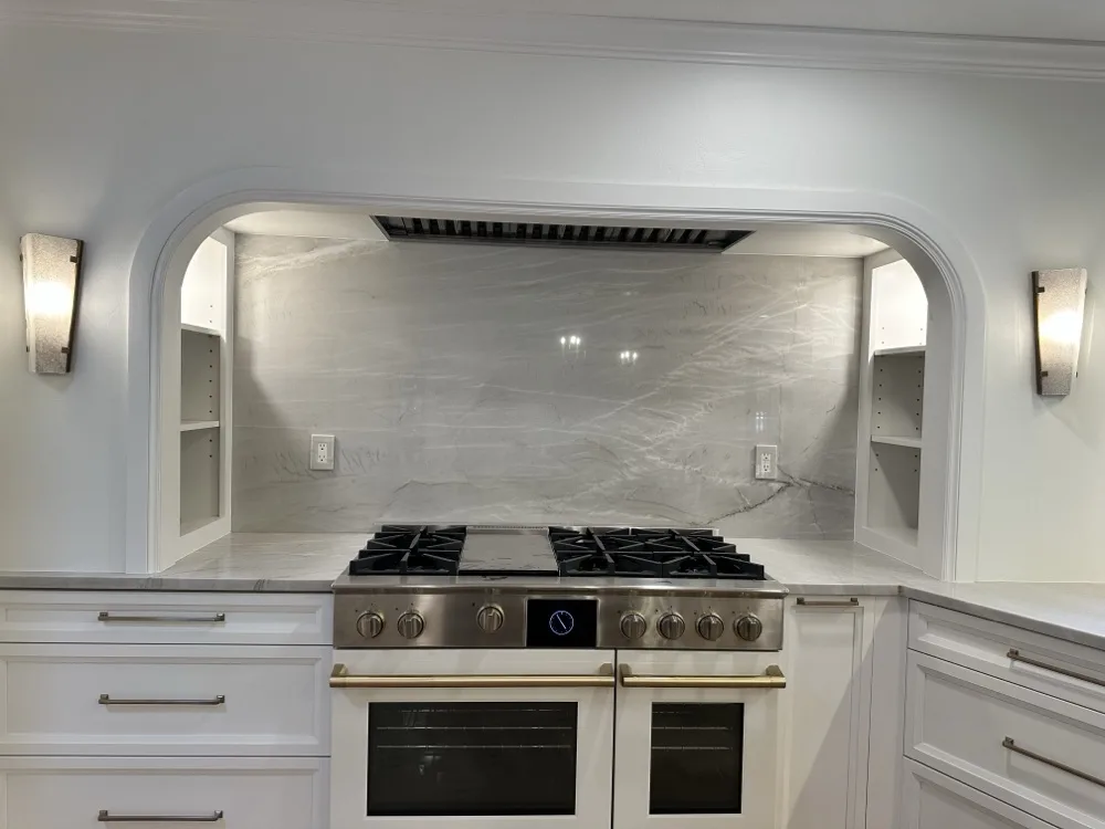 Professional six-burner range with double ovens in a home kitchen
